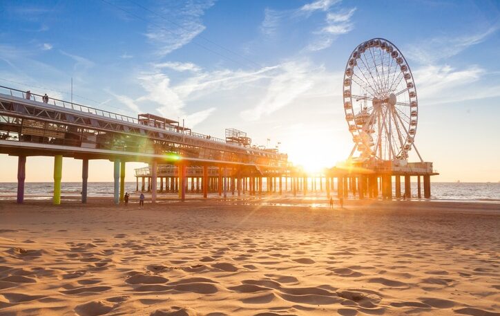 City brake lovely sunset on Scheveningen beach, famous Pier on background